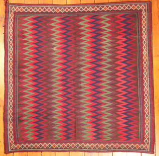 Turkish Sofreh Kilim Rug: Type: Rug Materials: Dyed wool Markings & Inscriptions: Unmarked (Zakian, Philadelphia tag) Date: Early to mid 20th century Maker: Turkish Description: A vintage Kilim rug with a colorful zig-zag