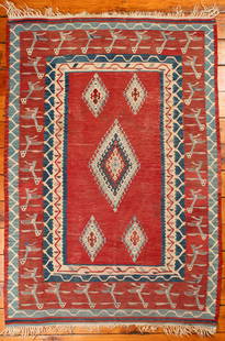 Turkish Kilim Rug: Type: Rug Materials: Dyed wool Markings & Inscriptions: Unmarked Date: Mid 20th century Maker: Turkish Description: A Kilim area rug decorated with bird-like figures and geometric motifs.