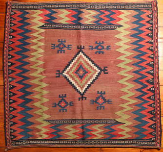 Turkish Sofreh Kilim Rug: Type: Rug Materials: Dyed wool Markings & Inscriptions: Unmarked Date: Early to mid 20th century Maker: Turkish Description: A Sofreh Kilim rug with geometric decoration. Dimensions: 50.5" x