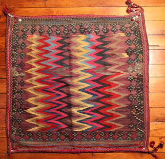 Turkish Sofreh Kilim Rug: Type: Rug Materials: Dyed wool Markings & Inscriptions: Unmarked Date: Early to mid 20th century Maker: Turkish Description: A colorful Sofreh Kilim rug with geometric zig-zag decoration and corner