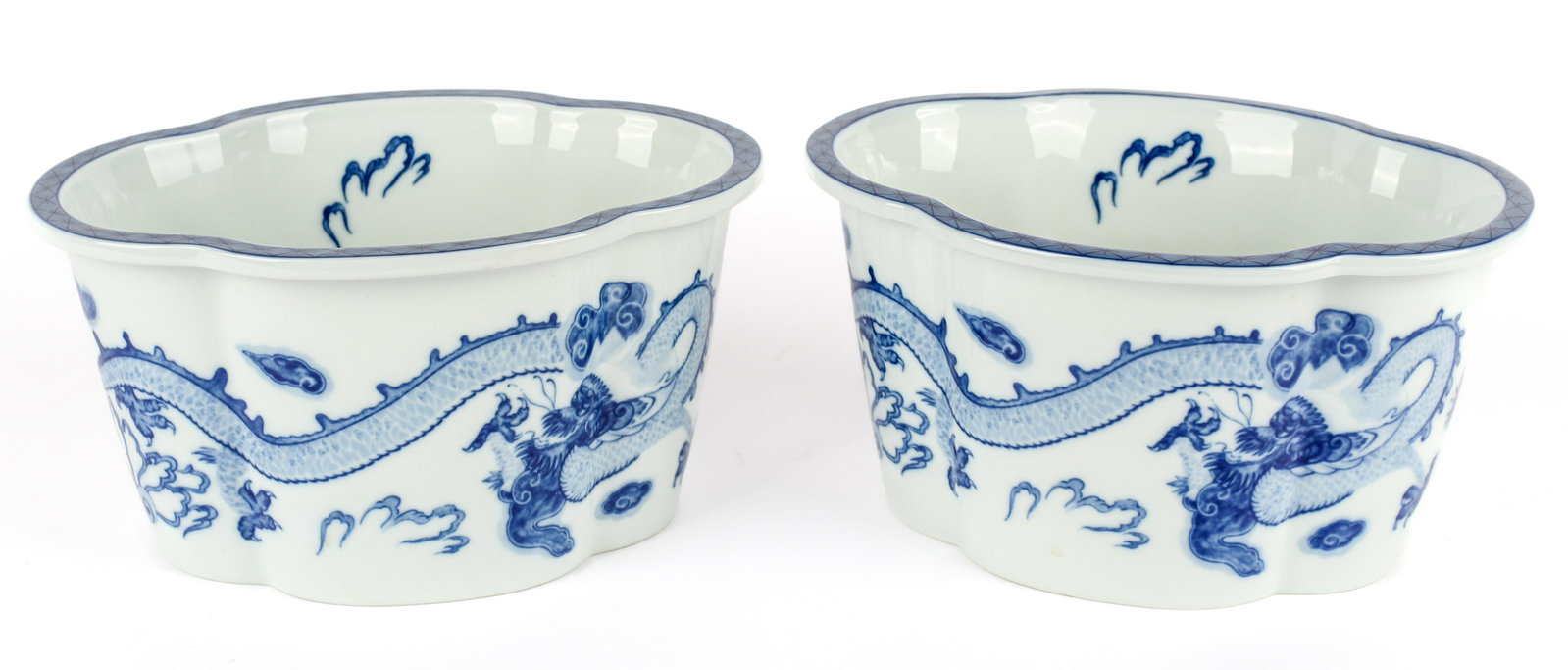 Mottahedeh for Tiffany & Co. Blue Dragon Planters: Type: Planter Materials: Porcelain Markings & Inscriptions: Marked base Date: Late 20th Century Maker: Mottahedeh for Tiffany & Co. Description: A pair of oval quatrefoil Canton style planters with Ch