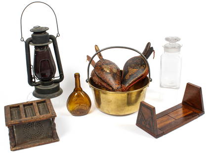 Estate Primitives: Description: To include a brass kettle with iron handle, a punched tin foot warmer, two sets of primitive painted bellows, a glass candy jar, an oak bookshelf, a Fislerville Glass Works Jenny Lind bot