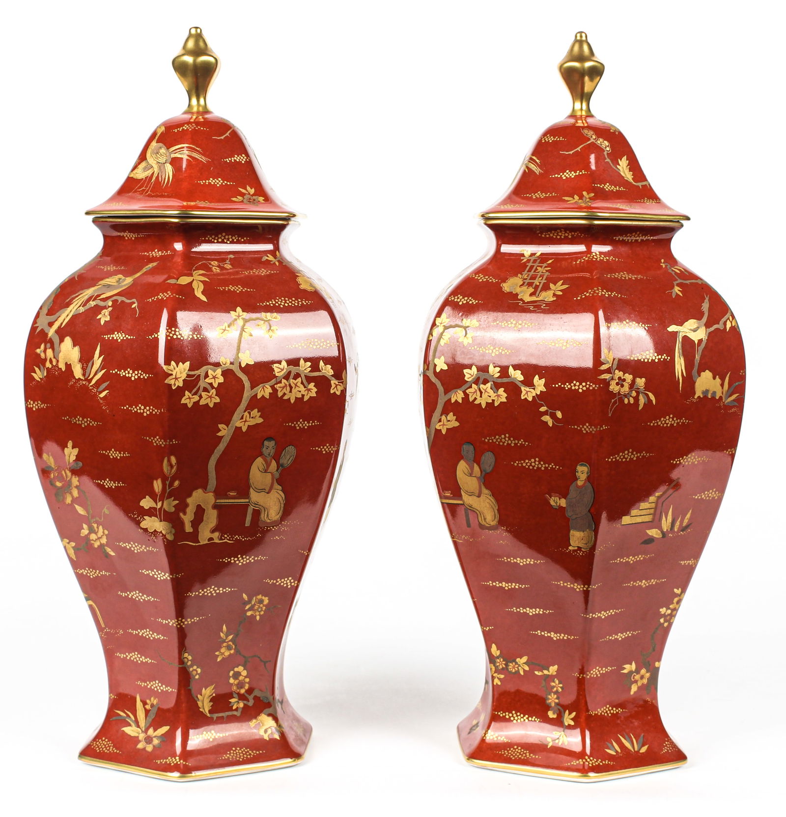 Bernardaud Limoges Porcelain Ginger Jar Pair: Description: A pair of French L. Bernardaud Limoges chinoserie porcelain ginger jars having gilt decoration depicting birds, botanicals a garden scene on a red ground. Type: Ginger jar Materials: Porc