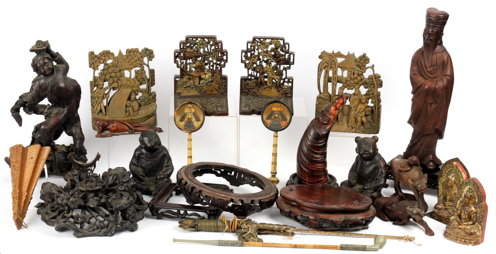 Chinese Decorative Arts Including Wood Carvings, Fan Holders: Description: A group of estate Chinese and Asian decorative arts to include two celluoid fan holders, an opium pipe, a Chinese coin sword, a large plaster figure of an immortal, a figural root carving