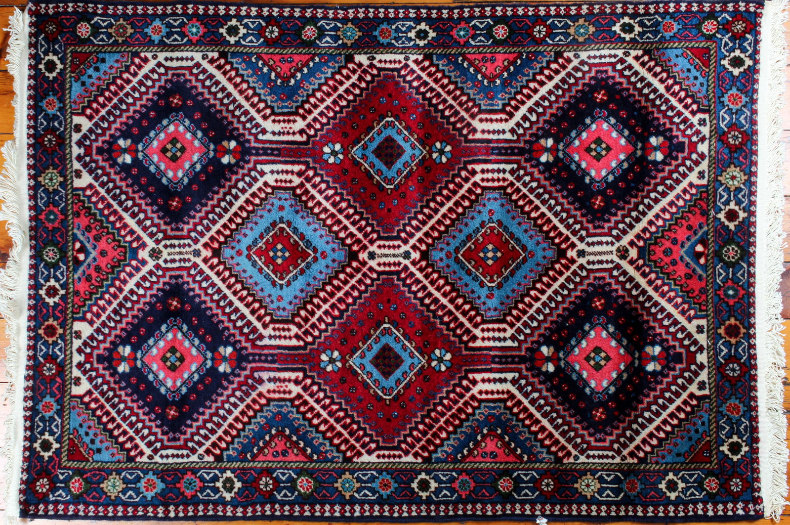 Persian Yalameh Wool Rug, 5' x 3.4': Description: A Yalameh rug with geometric medallions within optic borders. Type: Rug Materials: Wool Markings & Inscriptions: Unmarked Date: Mid to late 20th century Maker: Persian, Iran Dimensions: 6