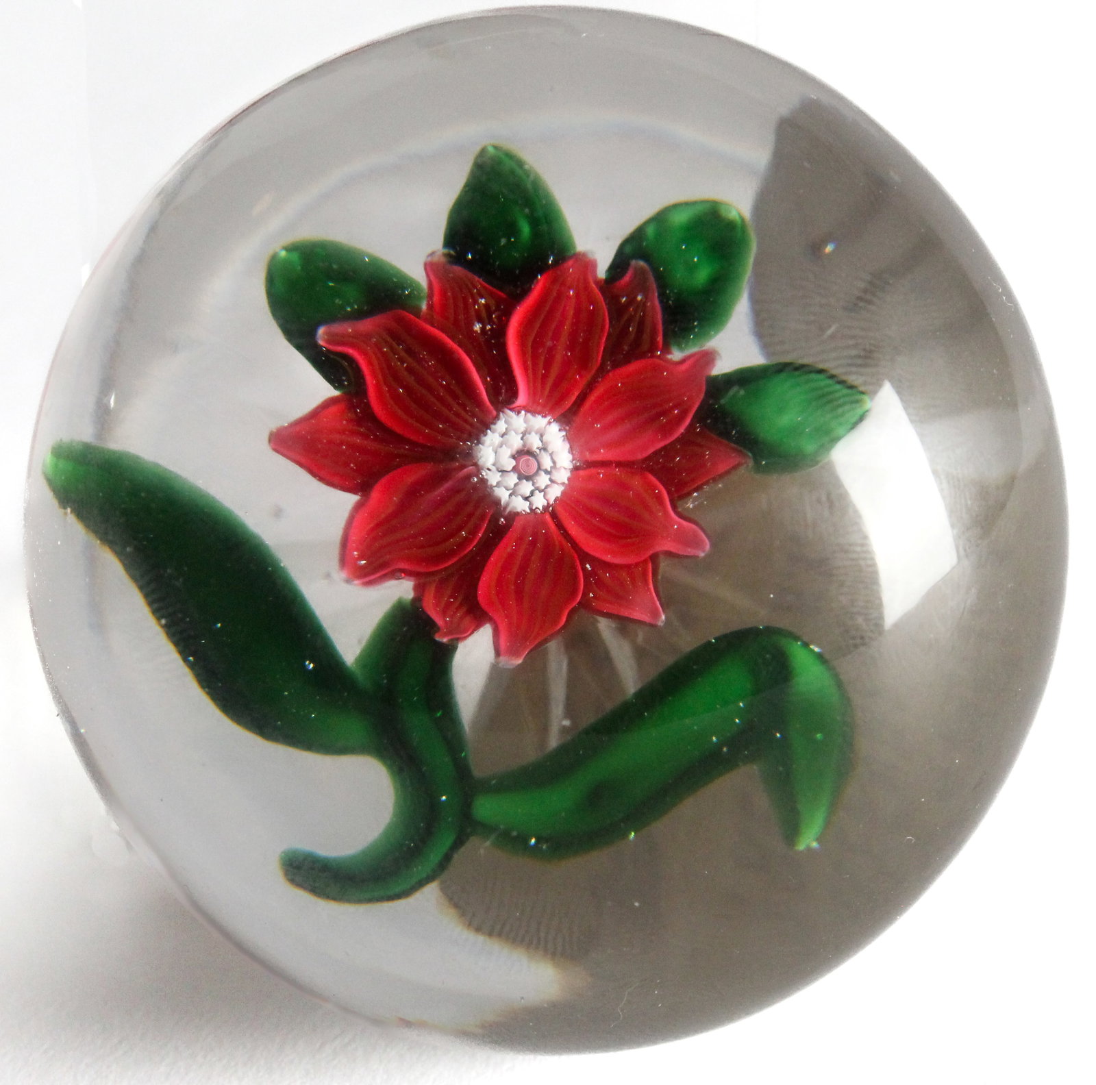 Baccarat Clematis Paperweight: Description: A 19th century Baccarat clematis paperweight with star-cut base, once part of the Theresa & Arthur Greenblatt Collection. Type: Paperweight Materials: Glass Markings & Inscriptions: Unmar