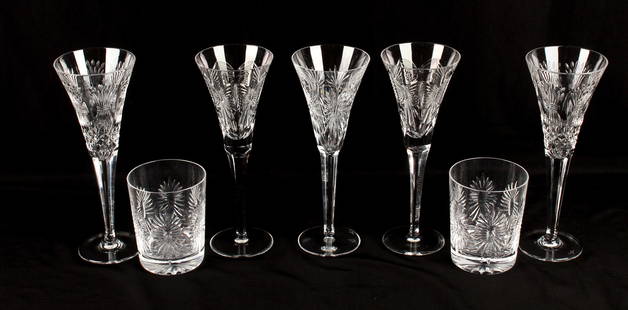 Seven Waterford Millennium Glasses, Incl. Five Toasting Flutes and Two Tumblers: Description: A group of seven Waterford Millennium series crystal objects including five toasting or champagne flutes and two tumblers. Type: Champagne flute, glasses Materials: Crystal Markings & In