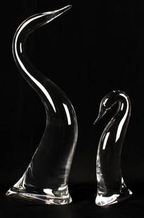 Steuben Glass, Graceful Heron & Young Heron, Two Sculptures: Description: A pair of Steuben contemporary art glass heron figures, the larger titled "Graceful Heron" and the smaller titled "Young Heron". Type: Sculpture Materials: Glass Markings & Inscriptions: