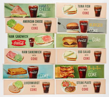 Coca-Cola, Twelve Diner Signs Ca. 1950: Description: A group of twelve lithographic Coca-Cola diner advertising signs ca. 1950 featuring a glass of Coke with various sandwiches. Type: Advertising sign Materials: Cardboard, paper Markings &