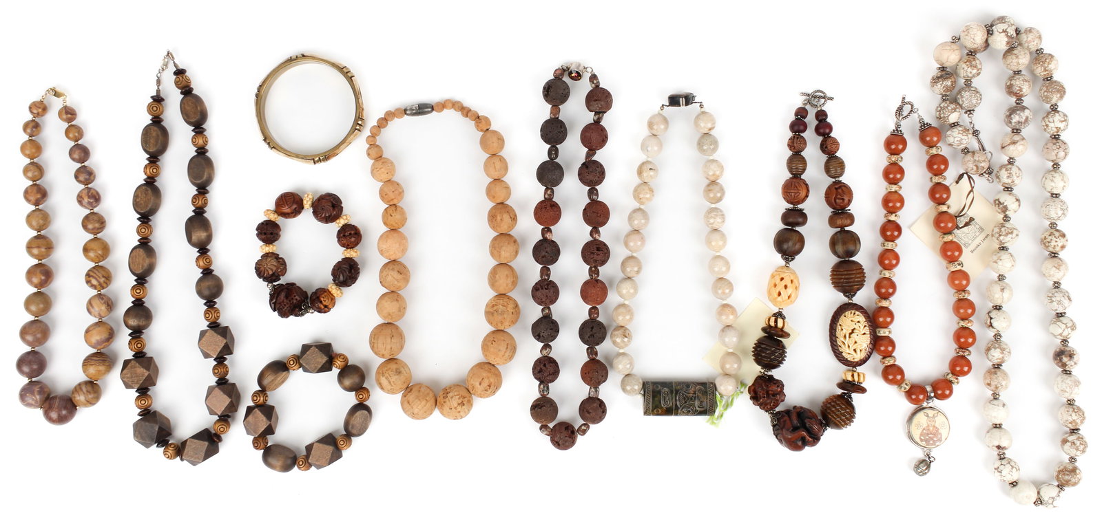 Eight Mixed Media Artisan Necklaces and Three Bracelets, Including Brooke Jaron: Description: Eight mixed media artisan necklaces and three bracelets by Sojourner, Brooke Jaron and others, in earthtone semi-precious stones, painted bone, porcelain beads, wood, cork and silver. Typ