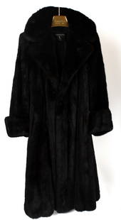 Vintage Valentino Mink Fur Coat: Description: A vintage Valentino mink fur coat, size medium.Type: Fur coatMaterials: Mink furMarkings & Inscriptions: LabeledDate: Late 20th centuryMaker: Valentino Dimensions: Size medium. Provenance