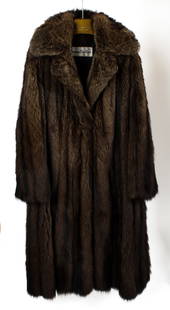 Vintage Christian Dior Raccoon Fur Coat: Description: A vintage Christian Dior raccoon fur coat, size large.Type: Fur coat Materials: Raccoon furMarkings & Inscriptions: Labeled Date: Late 20th century Maker: Christian DiorDimensions: Size l