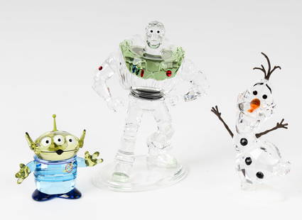 Three Disney Swarovski Crystal Figurines: Description: Three Swarovski Crystal figurines depicting Diney and Pixar charachters Buzz Lightyear,Toy Story Alien and Olaf. Type: Plate Materials: Crystal Markings & Inscriptions: Marked Date: Late