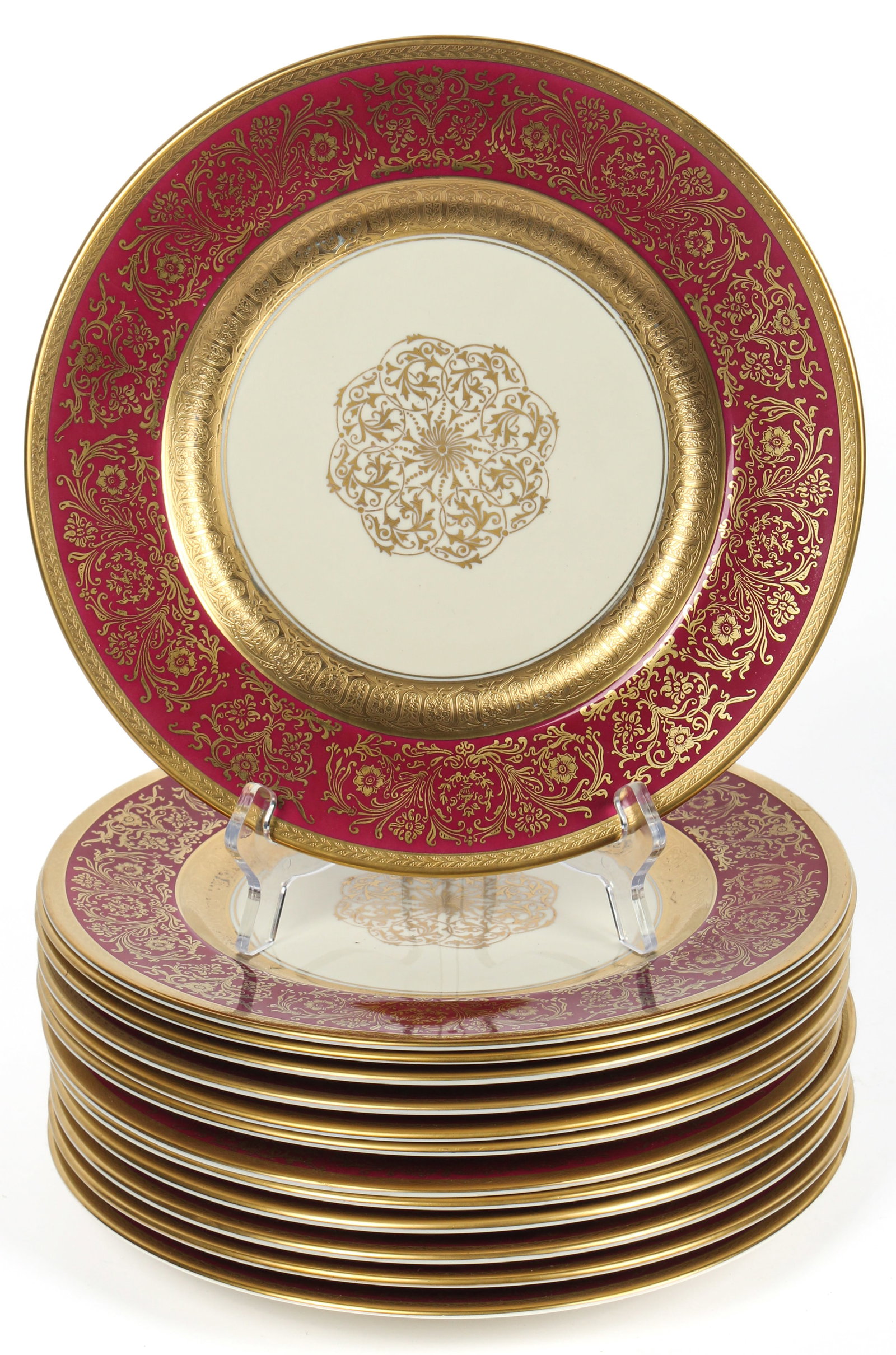 Thirteen Edgerton Porcelain 24k Gold Rim Cabinet Plates: Description: A group of thirteen 24k gold rimmed plates with red borders. Type: Cabinet plate Materials: Porcelain Markings & Inscriptions: Marked Date: Mid 20th century Maker: Edgerton Dimensions: 10