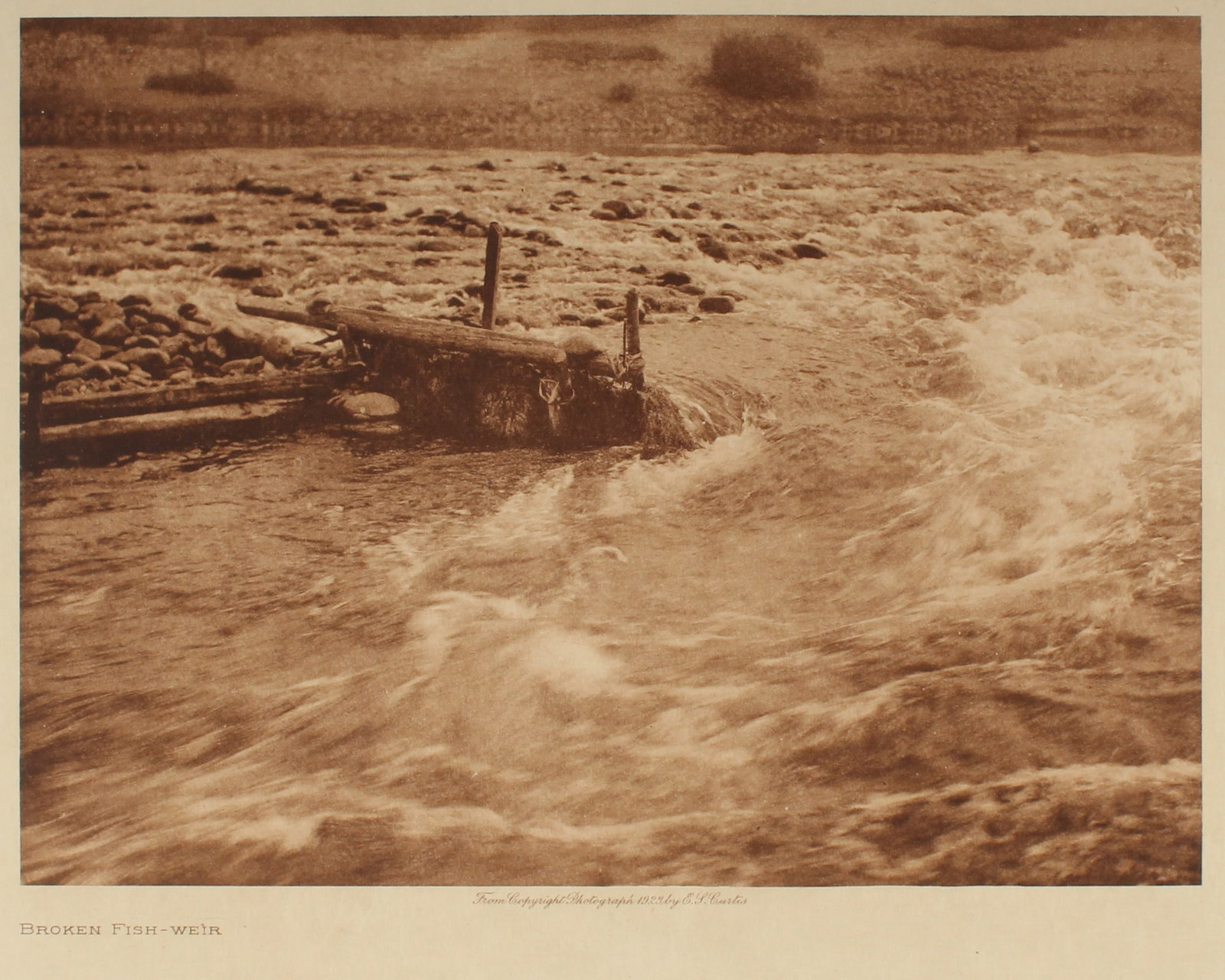 Edward S. Curtis (American, (1868-1952) Photogravure "Broken Fish-Weir" 1923: Description: An Edward Curtis photogravure from the 1923 copyright photograph, as part of his "The North American Indian" portfolio, 1907-1930. Museum specification framed / matted. Title: Broken Fish