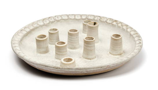 McCarty Art Pottery Menorah Candleplate, Merigold Mississippi: Description: A mid 20th century example, the handmade nine-light menorah or candleplate with a white crackle glaze and thumbprint-crimped edge. Type: Candle holder, menorahMaterials: Ceramic, stonewar