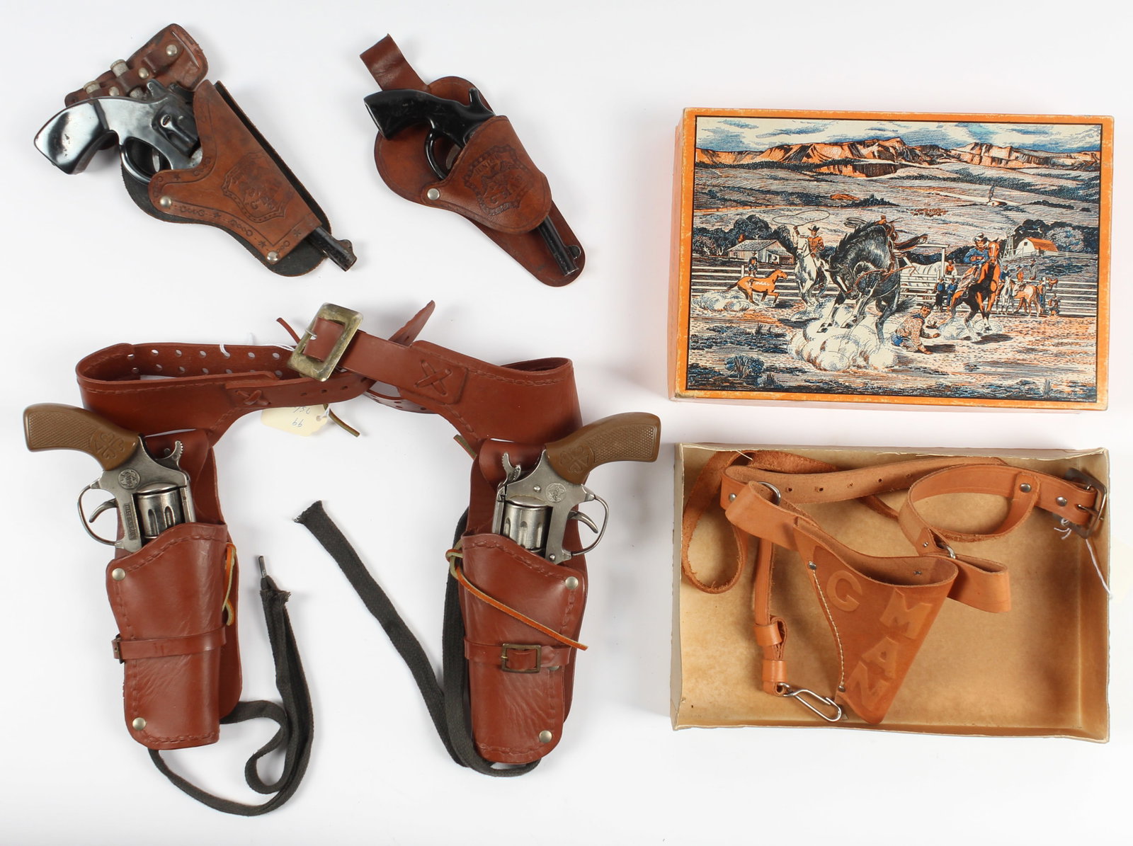Vintage G-Man & FBI Toy Holsters & Guns: Description: A group of four vintage leather holsters and four cap/toy guns, all with FBI and G-Man related markings. Type: Toy gun, holster Materials: Metal, leather Markings & Inscriptions: Marked D