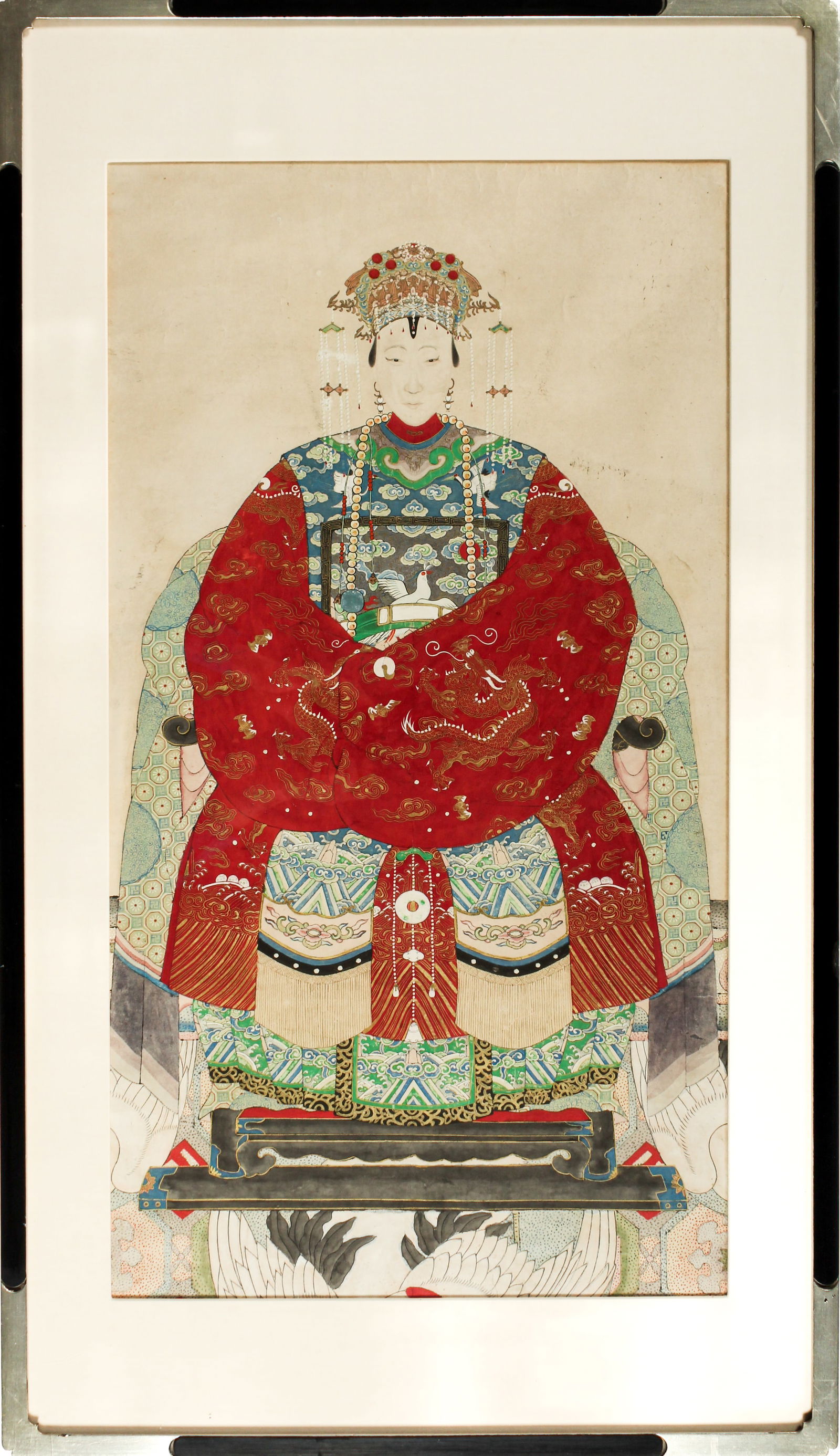 Antique Chinese Ancestor Portrait, Qing Dynasty: Description: A late Qing example depicting a woman seated in an emroidered silk textile covered chair, wearing an embroidered silk robe with central bird decorated rank badge and an elaborate headdres