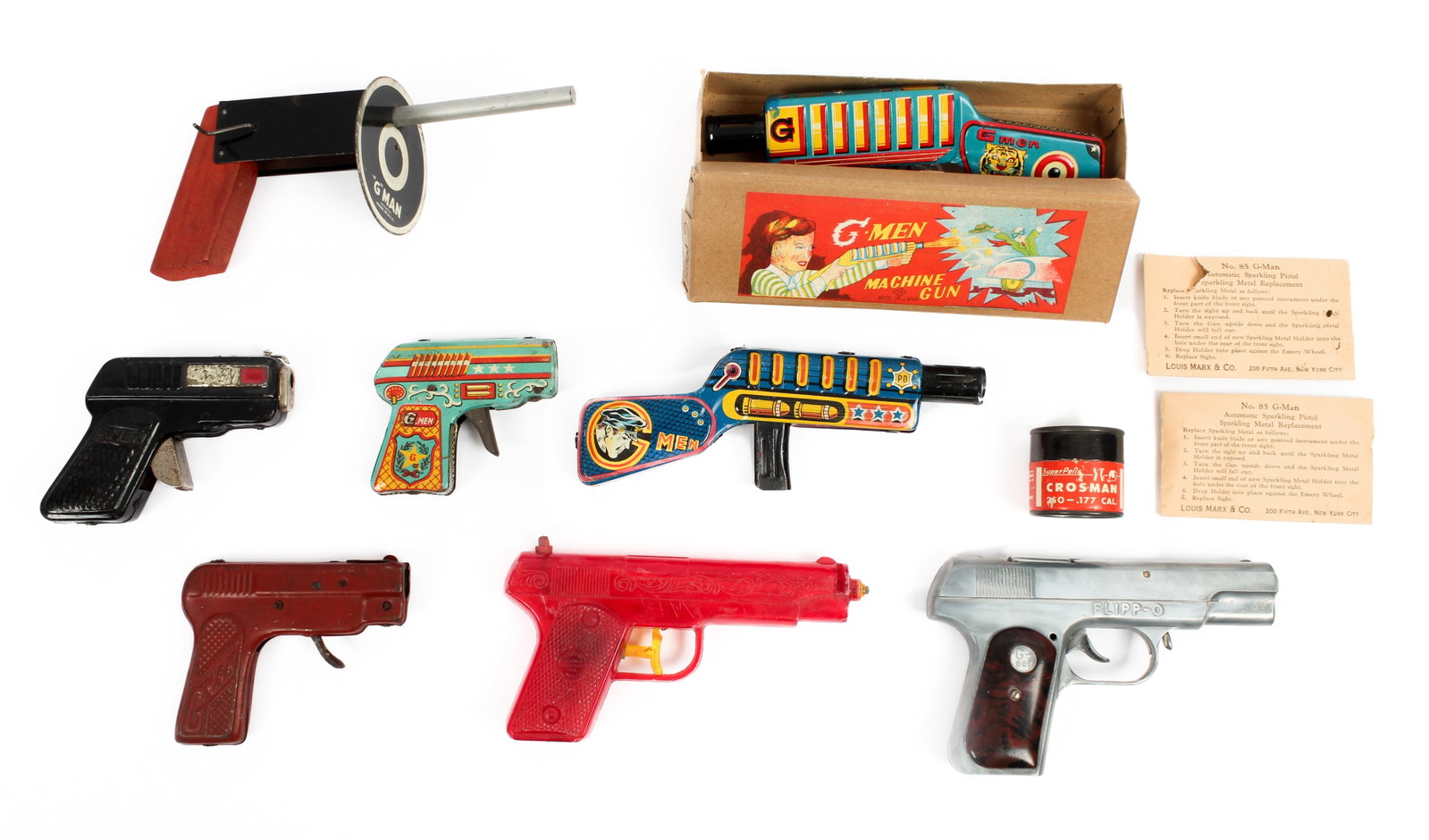 A Group of Eight G-Men FBI Toy Guns, TN Japan Wind-Up, Asahi Toy, Cap Gun, Other: Description: A collection of 8 G-Men related toy guns to include: a TN Japan wind-up machine gun in original box, a similar friction machine gun marked for Asahi Japan, a G-Boy 'Flipp-O cap gun, a Pre