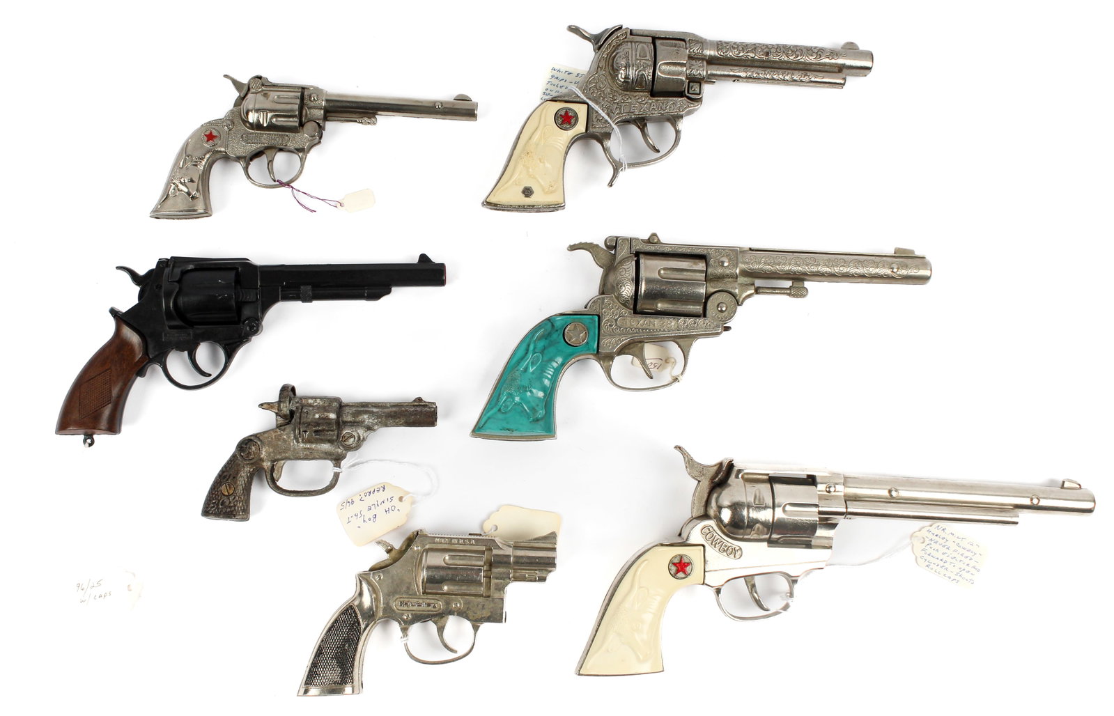 Seven Vintage Toy Guns Incl. Hubley Texan 38, Trooper, Sure-Shot, Etc.: Description: Seven toy guns to include: a Texan .38, a Trooper snub nose cap gun pistol, a Sure-Shot cap gun, a Hubley Cowboy 12" gun with white longhorn steer-head handle grips, a Hubley Texan 9.5" m