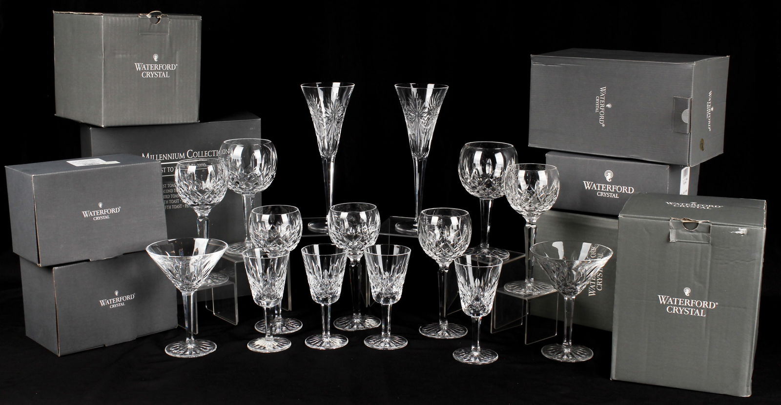 A Collection of Waterford Crystal Goblets, Hocks, Milennium Flutes, Etc.: Description: A collection of Waterford Crystal stems to include: a pair of Milennium champagne toasting flutes, a pair of Lismore balloon wine glasses, a pair of Lismore martini glasses, 4 Lismore win