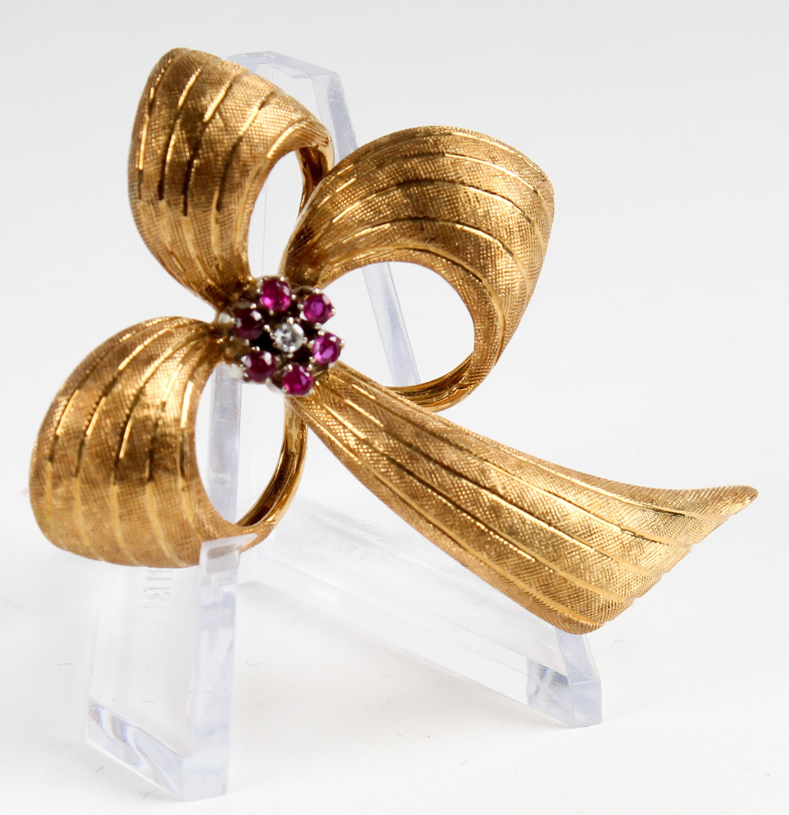 An 18k Gold Bow Brooch With Rubies And A Diamond In A Platinum Setting (1 of 3)