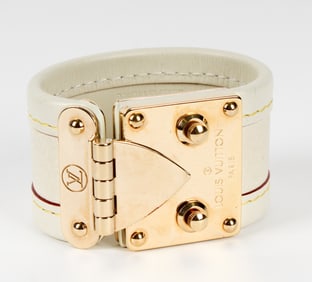 A Louis Vuitton Suhali Serrure Cream Leather Bracelet With Gold Tone Hardware
