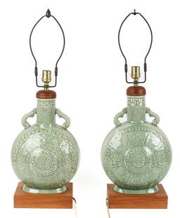 Mid Century Thai Celadon Pottery Moon Flask Lamps: Description:A pair of Thai mid-centry large celadon incised pottery moon flask lamps, each with wood bases and trim, both with adjustable harps. Materials: Pottery, wood Markings & Inscriptions: Label