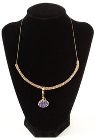 A Fancy Link Necklace With A 14K Gold Accented Lapi Lazuli Charm
