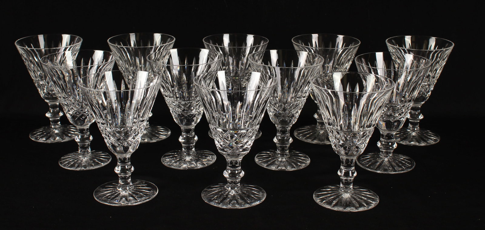 Twelve Waterford Crystal Tramore Claret Wine Glasses: Description: A group of twelve claret wine stems in the Tramore pattern. Markings & Inscriptions: Marked Date: Late 20th centuryMaker: Waterford Dimensions: 5 1/8" H. Provenance: From a Devon, Pennsyl