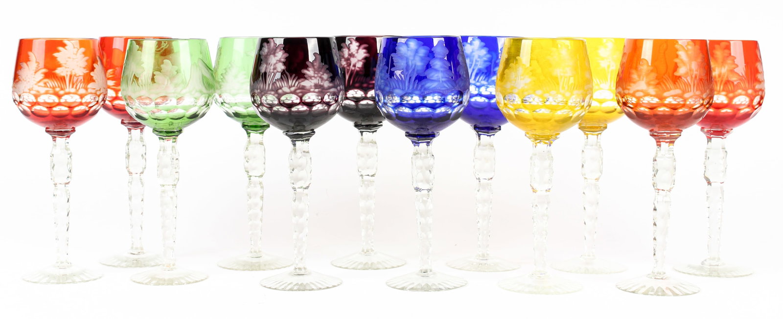 Twelve Bohemian Cut-to-Clear Wine Glasses, In Six Colors, Depicting Wildlife: Description: A group of twelve Bohemian cut-to-clear wine glasses in red, orange, yellow, green, blue and purple. Two of each color. Decorated with scenes of wildlife including a bear, deer, stag, phe