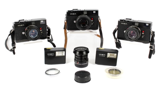 Three Minolta CLE Rangefinder Cameras, Accessories
