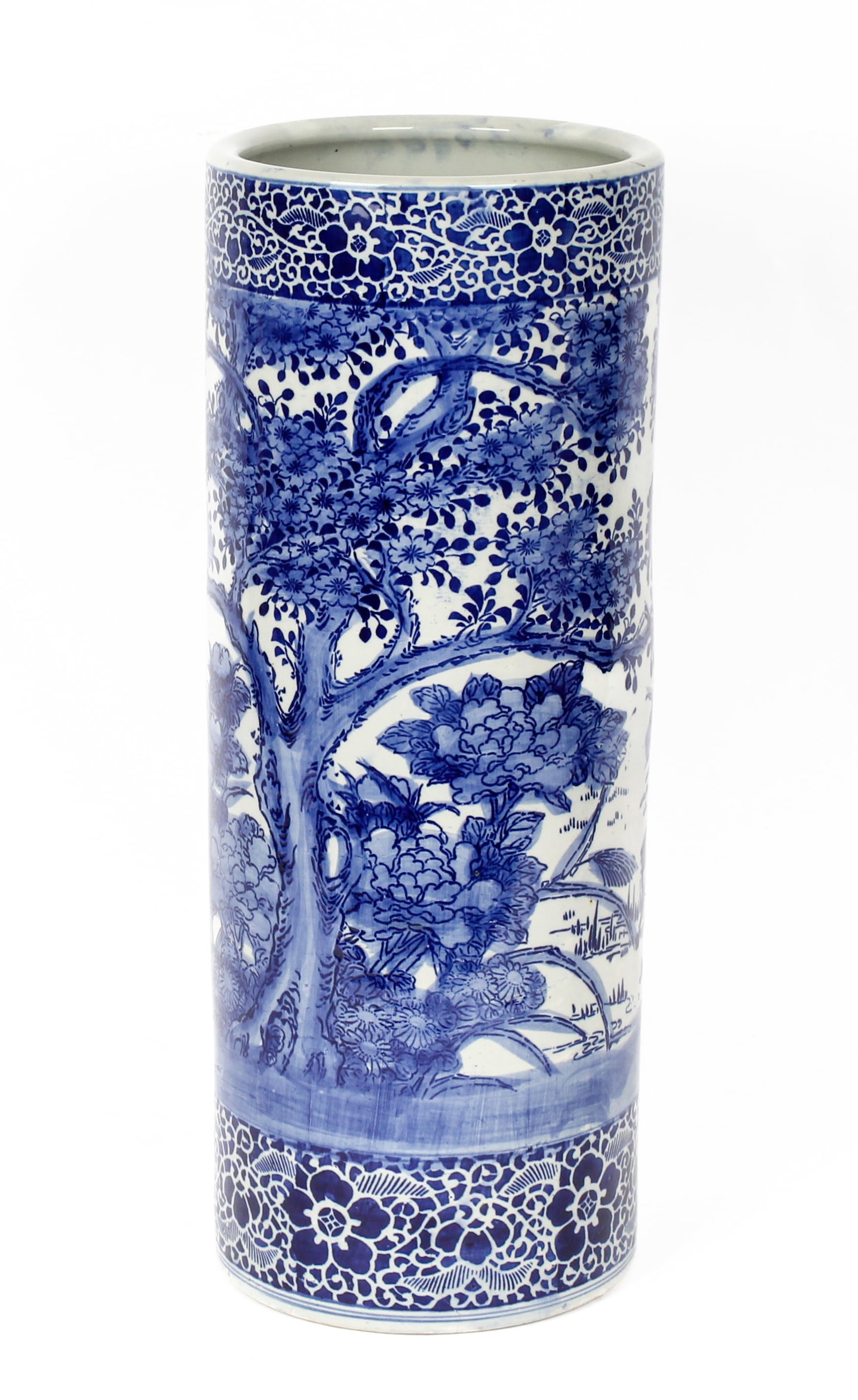 Japanese Blue and White Porcelain Umbrella Stand: Description: A Japanese blue and white porcelain umbrella stand decorated with flowers and trees. Markings & Inscriptions: Unmarked Date: 20th century Maker: Chinese Dimensions: Height: 24.75", Diamet