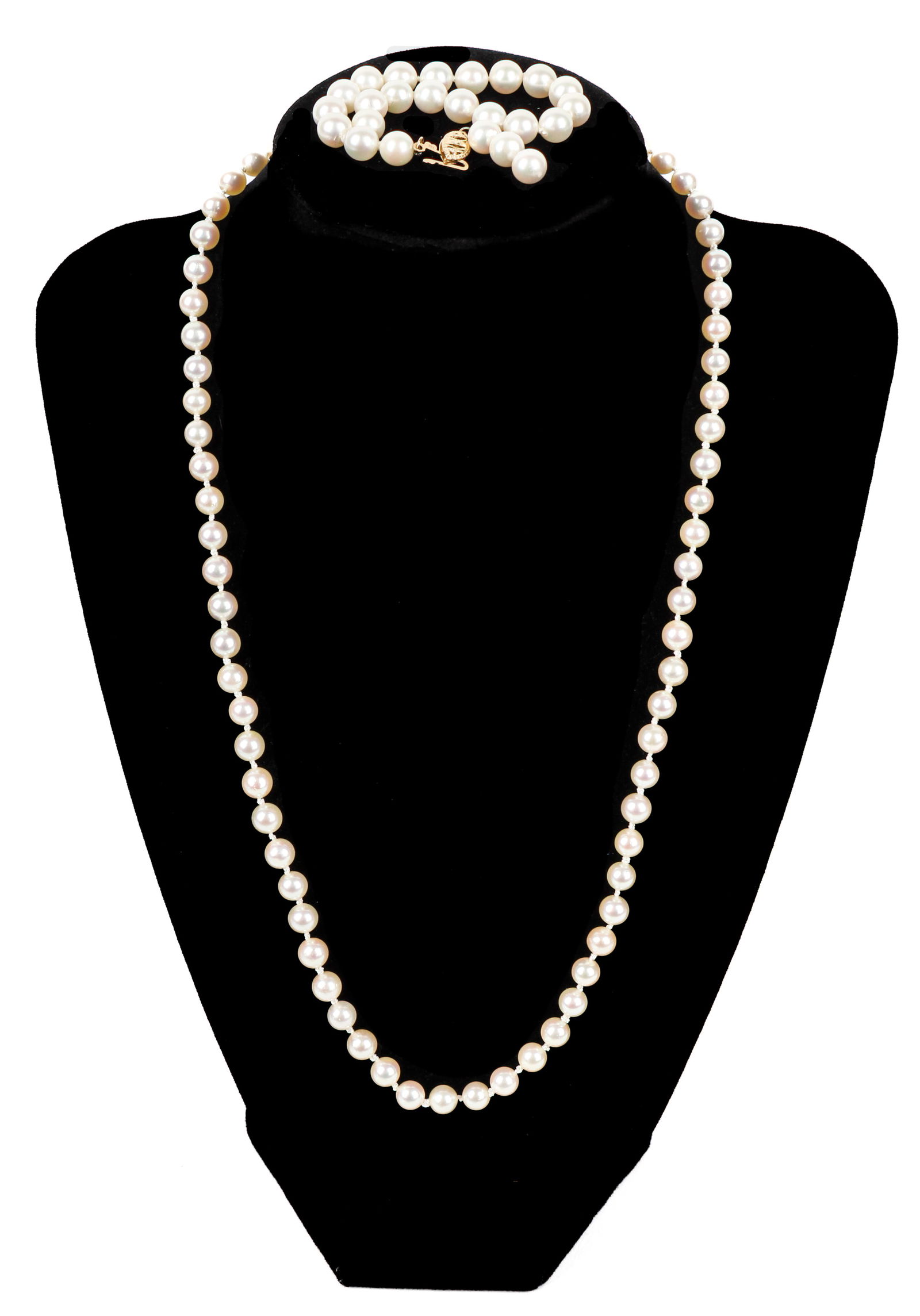 Pearl Bracelet and Necklace: Description: Pearl Necklace measuring approximately. 20" in length, strung with 5.8mm pearls, neutral with pink undertones, and one pearl bracelet strung with 6.6 mm white pearls. Both have a traditio