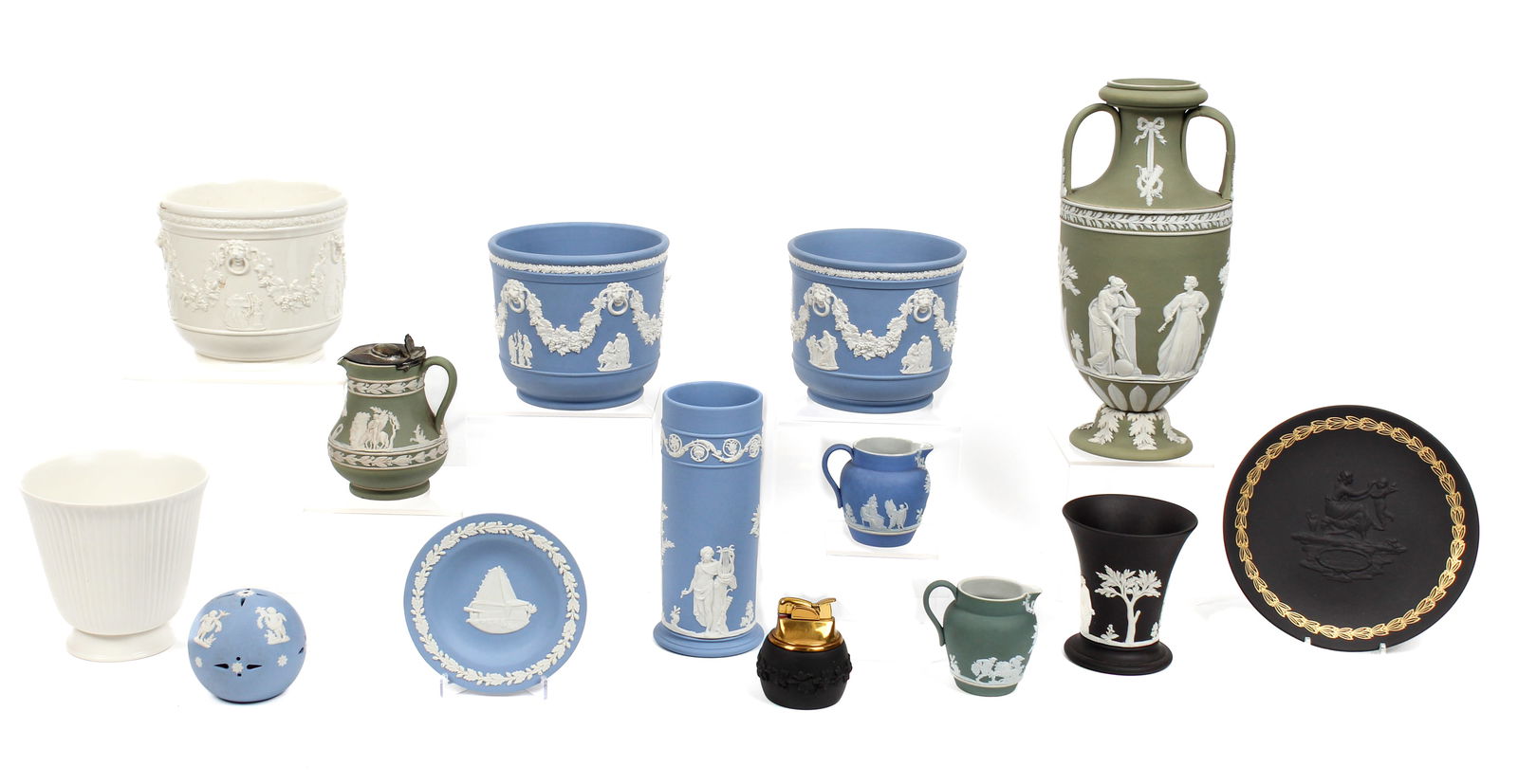 Fourteen Pieces of Wedgwood Jasperware, Eleven Commemorative Plates: Description: A group of fourteen pieces of Wedgwood in various colors, including two pieces of Wedgwood of Etruria & Barlaston. To include two Wedgwood of Eturia & Barlaston cache pots, a sage green t