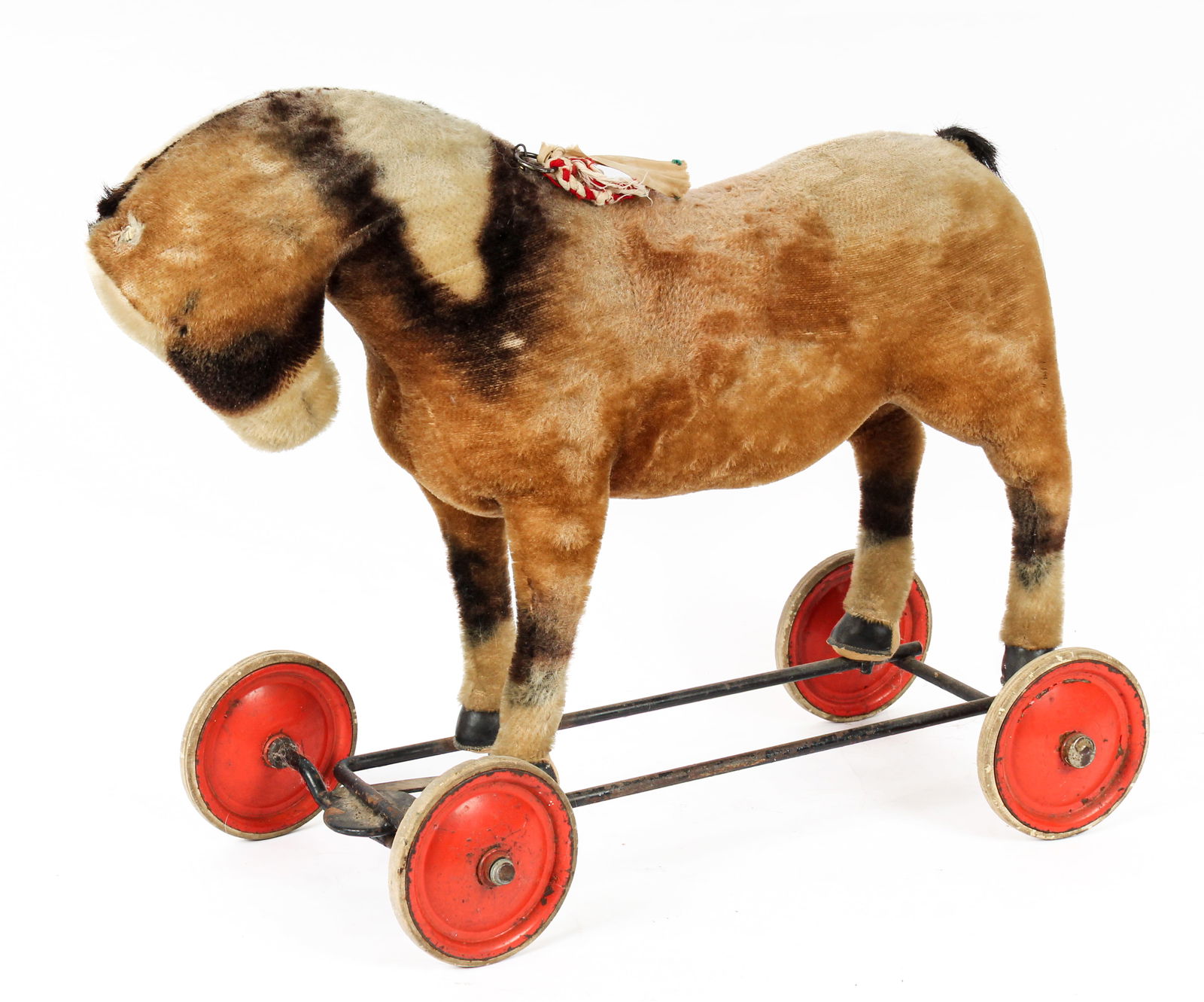Vintage Steiff Ride On or Pull Toy Horse on Wheels: Description: A vintage Steiff ride on or pull toy horse on wheels. Wooden/saw dust interior with mohair exterior mounted on a metal frame with wooden and metal red painted wheels. Has original horseha