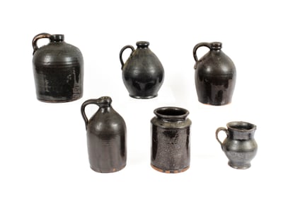 Six Brown Glazed Redware Jugs and Crock