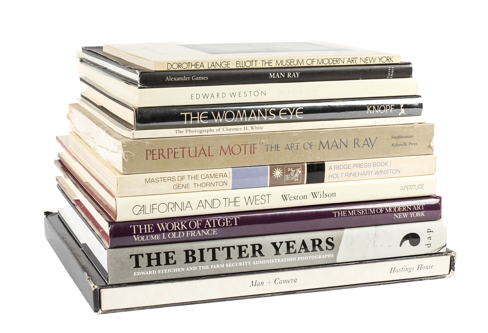 Eleven Monographs and Photography Books on Early 20th Century Photographers: Description: Eleven books, exhibtion catalogs, and monographs on early photographers, including Edward Weston, Dorothea Lange, Man Ray, Eugene Atget, Edward Steichen, and Victor Keppler. Titles includ