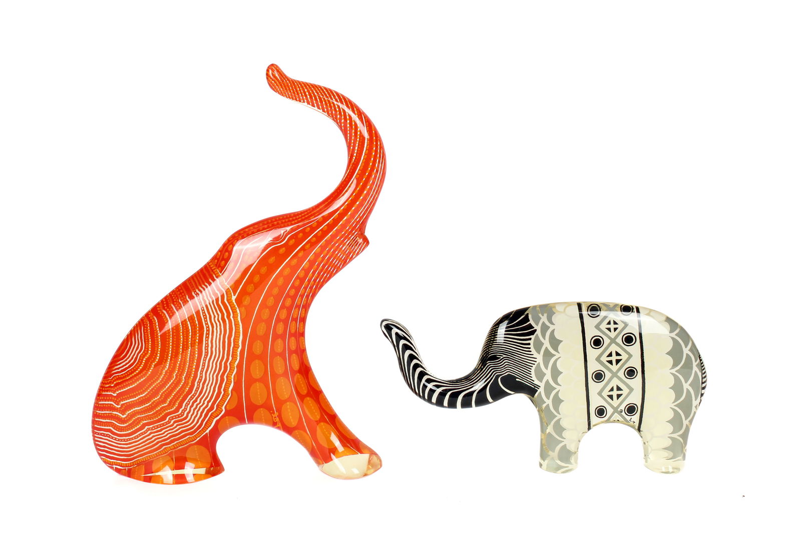 Abraham Palatnik (Brazilian, 1928-2020) Two Optic-Art Lucite Elephants: Description: Two optic-art lucite elephants by Abraham Palatnik. One depicted standing, the orange elephant sitting, both with trunks raised. Markings & Inscriptions: Signed Date: 20th century Maker: