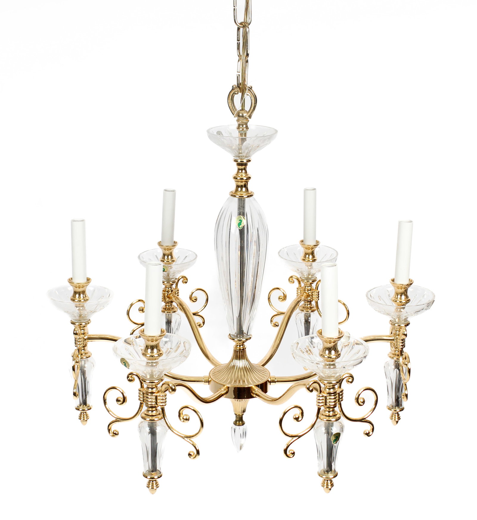 Waterford Carina Six-Arm Chandelier: Description: A Waterford 'Carina' six-arm crystal and gold-plated chandelier with scroll-work gold details and acorn finials, cut crystal bobeches, shaft, and drop pendants with vertical wedge cuts. M