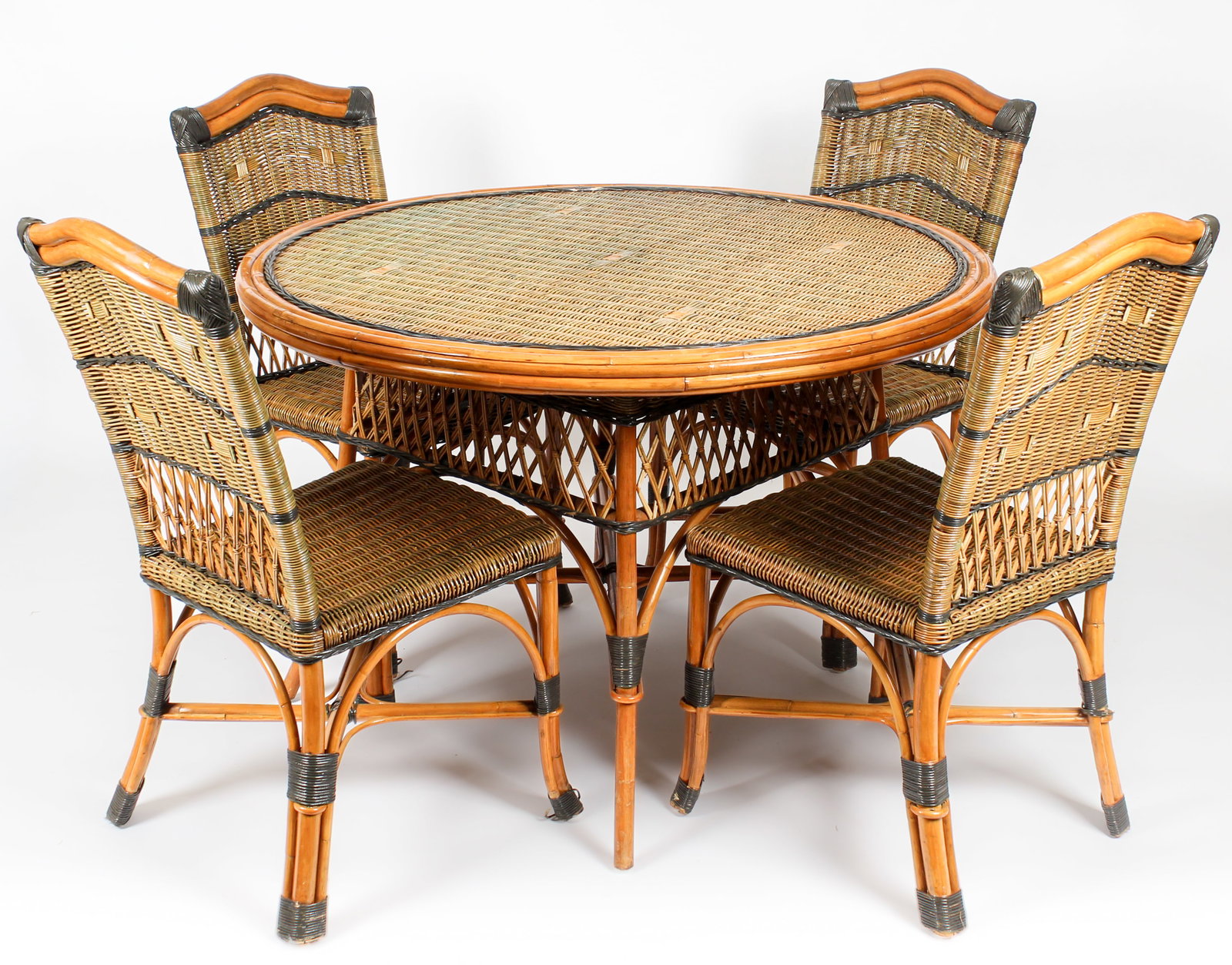 Grange French Art Deco Style Rattan and Bamboo Dining Set: Description: A Grange Co. rattan and bamboo dining set with four chairs with a round, glass topped table. The chairs with high backs and bamboo crests with polychrome decorated woven, rattan panels an