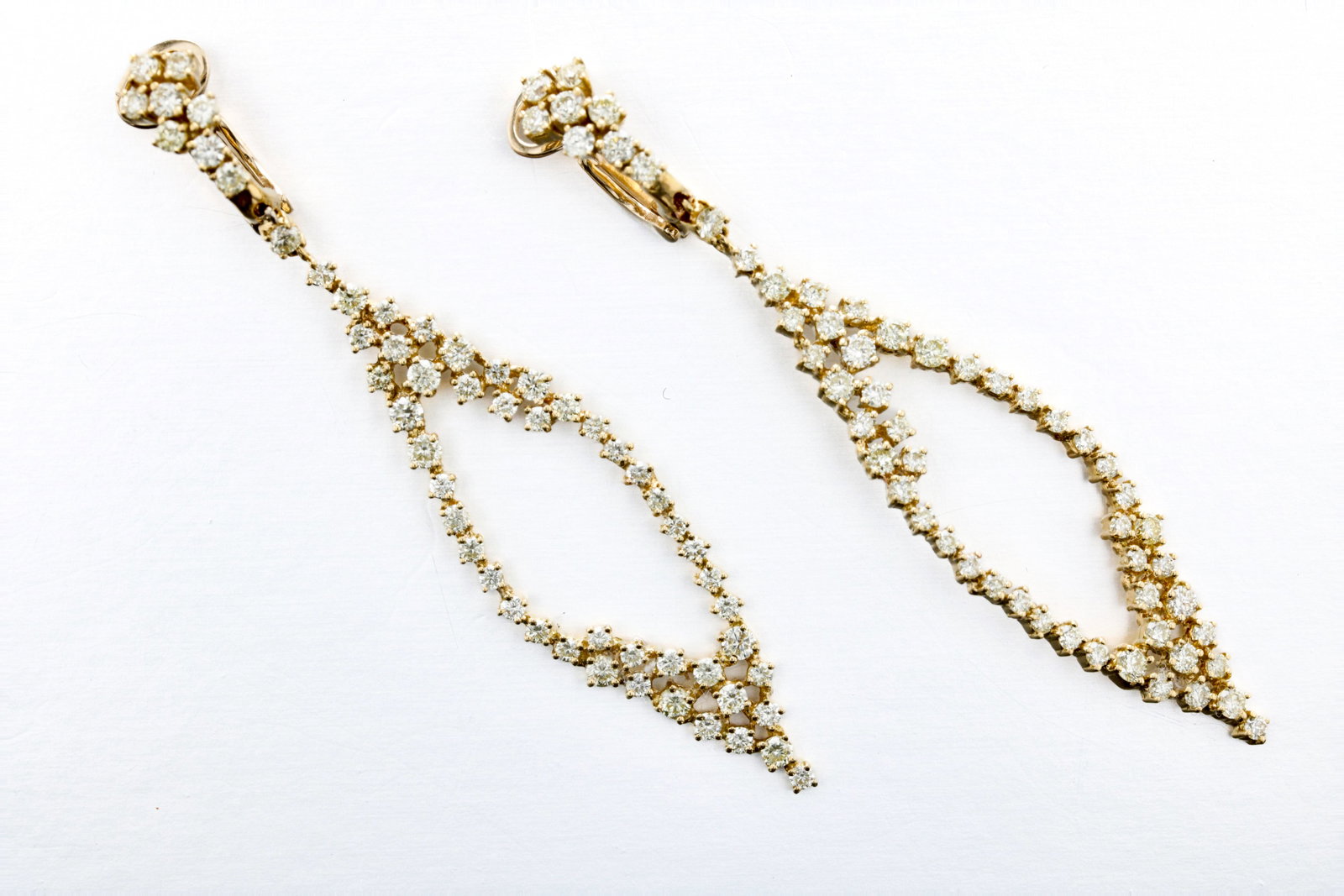 18K Gold Geometric Diamond Earrings: Description: A pair of 18K yellow gold geometric drop diamond earrings, approx. 1.10 CT.TW. Markings & Inscriptions: "750 Italy" Date: Contemporary Maker: Unknown Dimensions: L: 2.5" x 1/2" Weight: 6.