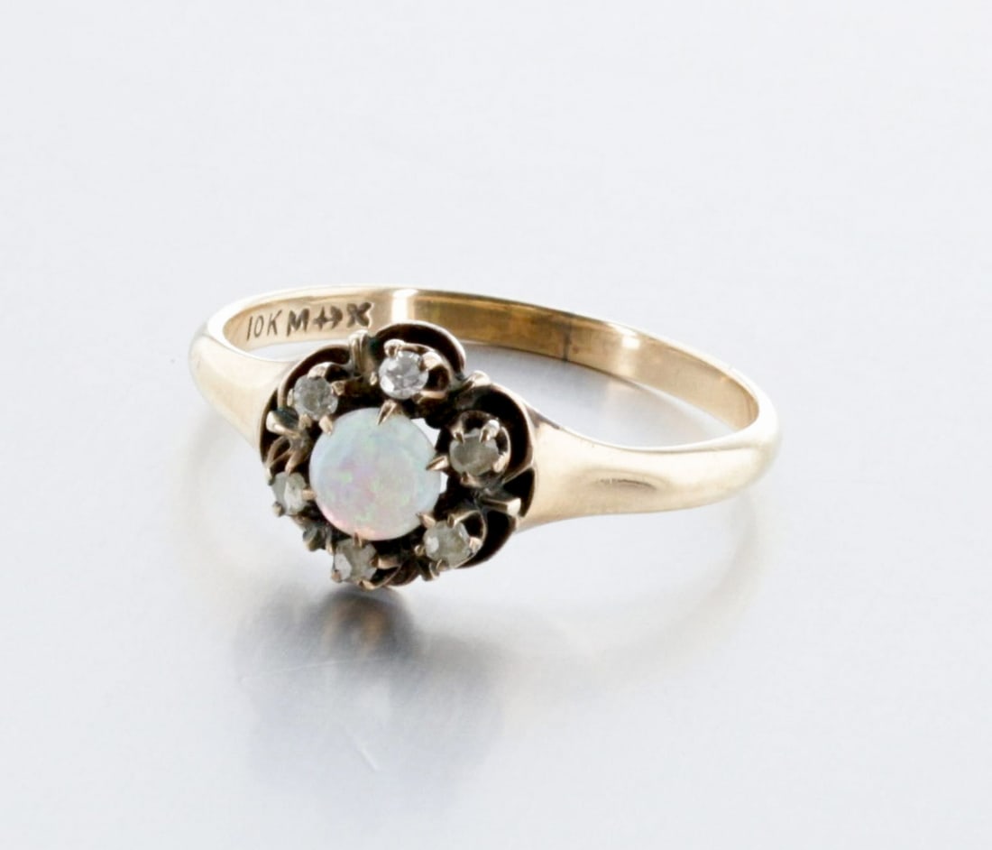 10K Gold Victorian Opal and Diamond Ring: Description: A 10K ladies ring, set with rose-cut diamonds centered by a round 4.0mm Opal cabochon, Markings & Inscriptions: Marked "10K" and maker's mark. Date: Victorian, Late119th Century Maker: Mo