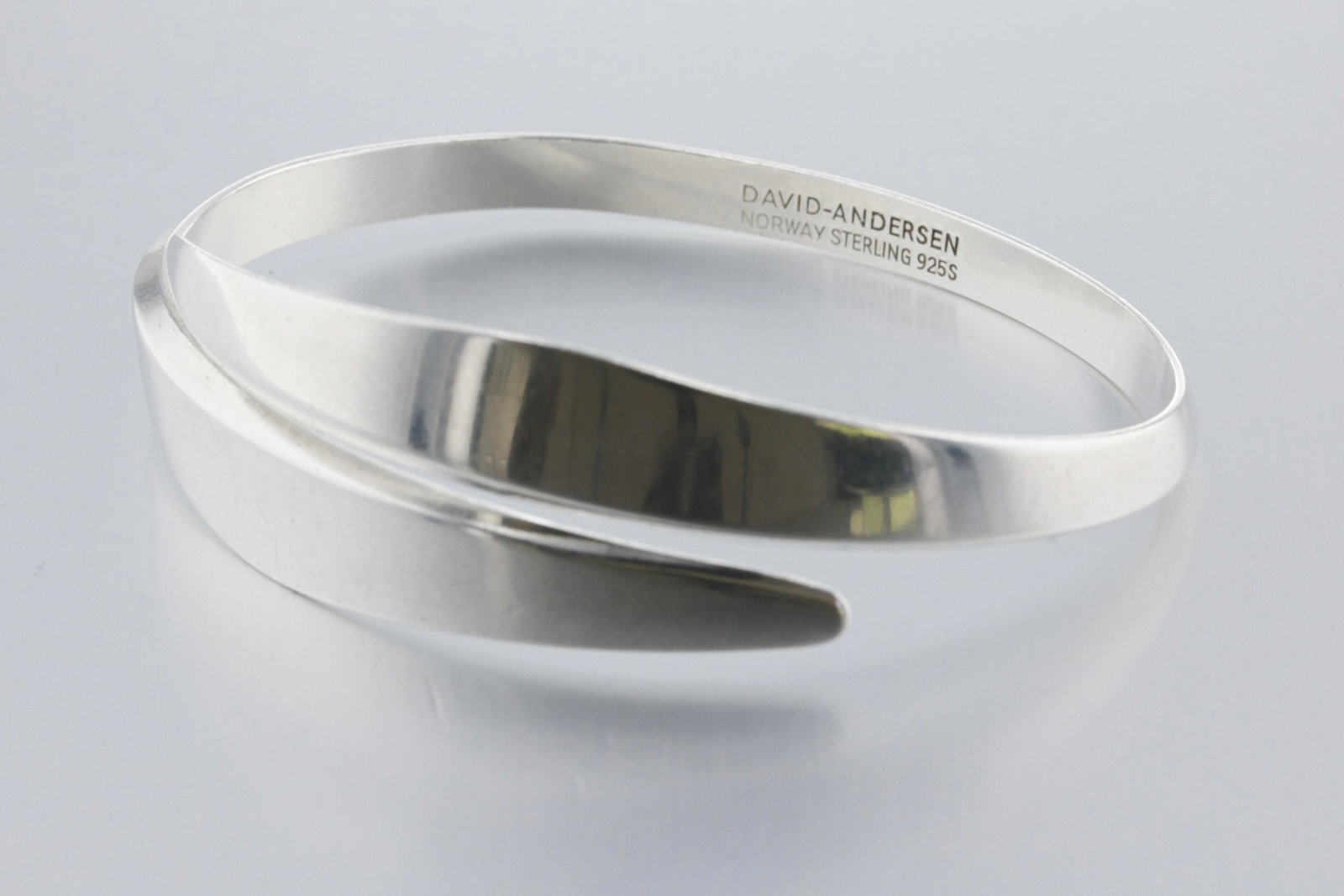 David Andersen Bangle Bracelet: Description: A David Andersen bracelet with a split-open cuff style design. Markings & Inscriptions: Signed "David-Andersen Norway 925S Sterling" Date: Mid-20th Century Maker: David Andersen, Norway D