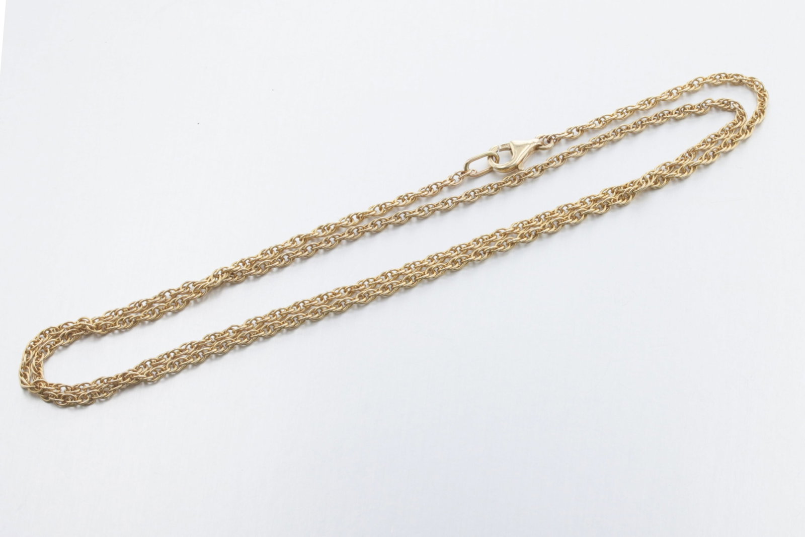 14K Gold Chain: Description: A 14K Yellow gold chain with a trigger clasp Markings & Inscriptions: Date: Contemporary Maker: Unknown Dimensions: L: 24", Thickness: 2mm., Weight: 5.5 Dwt. Provenance: From a Philadelph