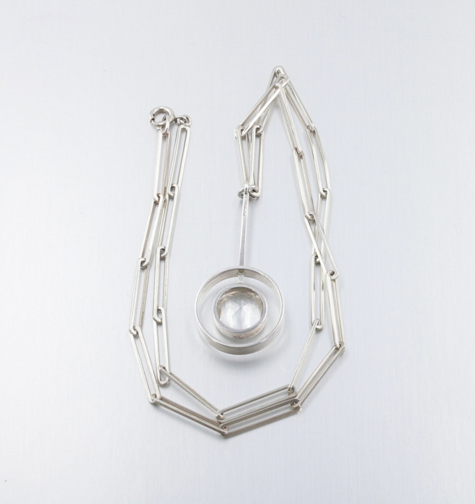 Niels Erik From (N.E From) Quartz Lariat Necklace: Description: A Sterling silver N.E. From a rock crystal gemstone paperclip link lariat necklace. Markings & Inscriptions: "N.E. From" Date: Mid-20th Century Br>Maker: Niels Erik From "N.E From" Dimens