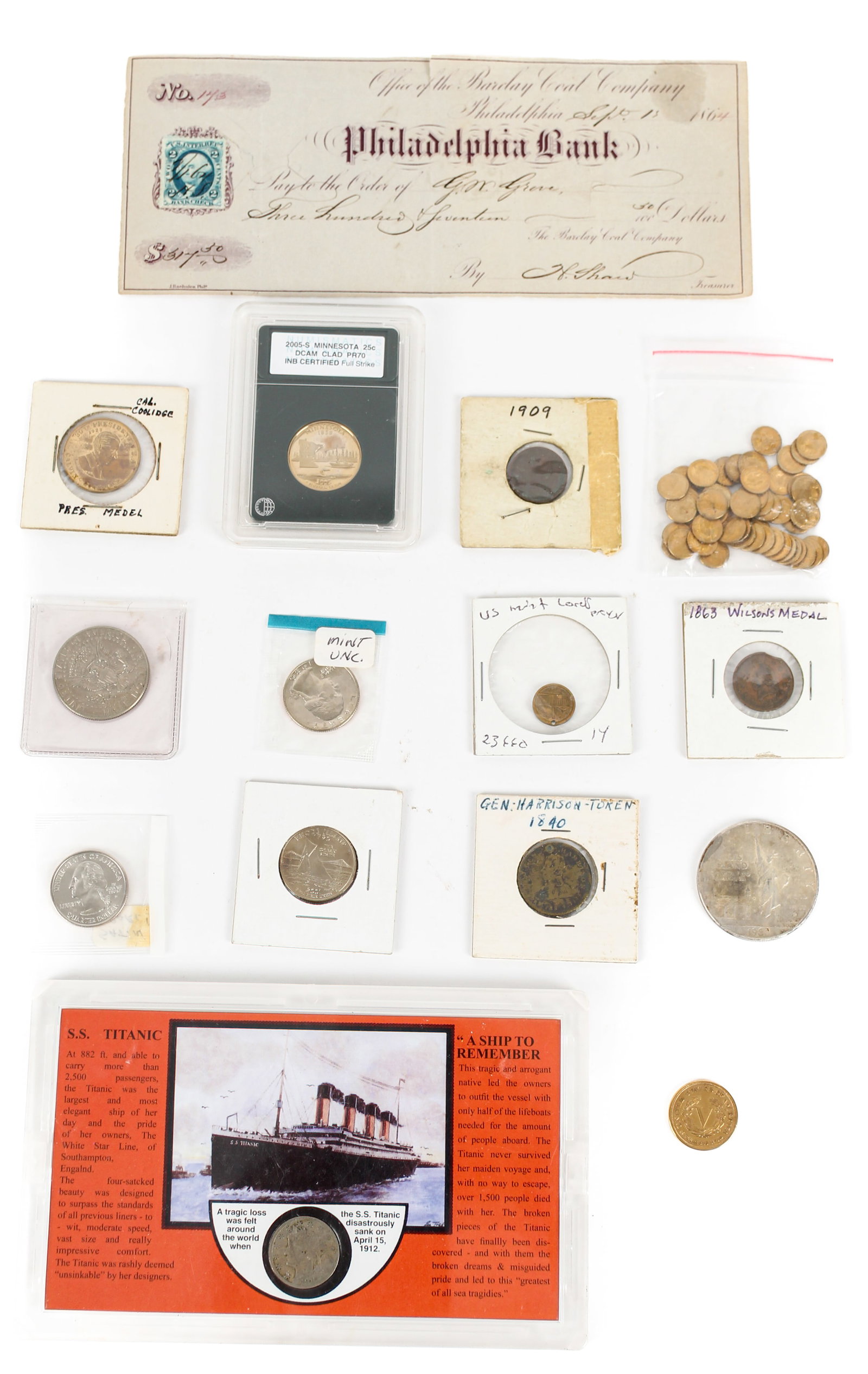 Collectible American Coins: Description: An assortment of collectible American coins and currency. Included is a 1912 nickel in a commemorative Titanic-themed case, a Civil War-era Barclay Coal Company check from 1864, 52 mini S