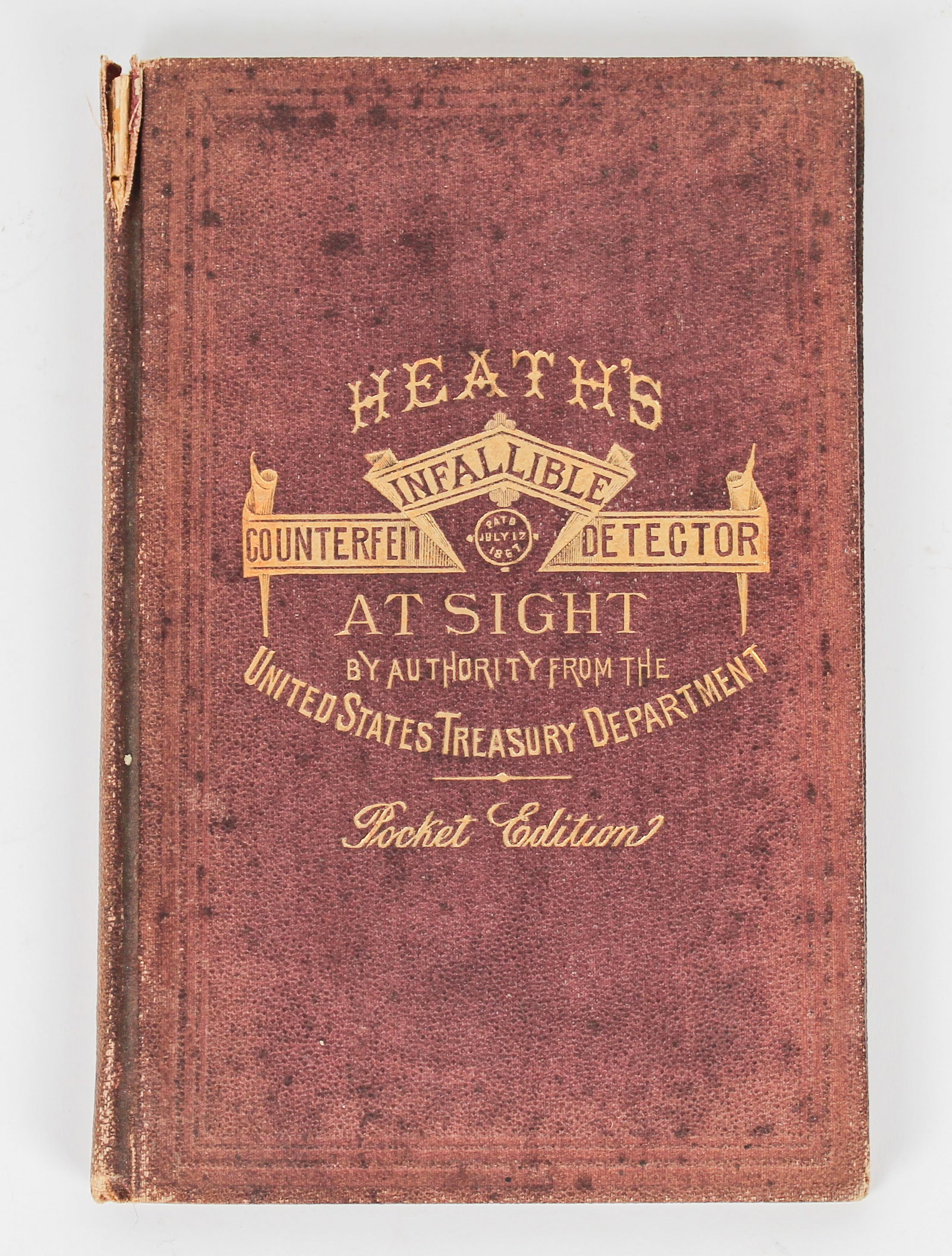 Heath's Infallible Counterfeit Detector, 1873, Pocket Edition: Description: A 1873 edition of Heath's publication on detecting counterfeit currency. Eleventh edition. Markings & Inscriptions: Marked Date: 1873 Maker: Laban Heath, & Co. Dimensions: 6.625" x 4.5". 