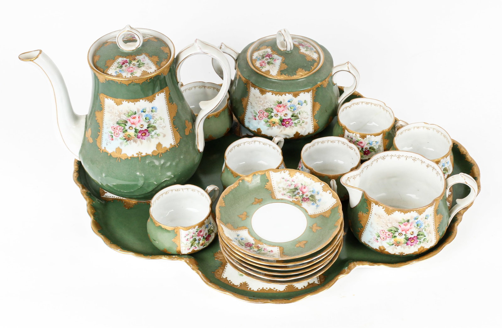 Attributed to Royal Bayreuth, Hand Painted Porcelain Tea Set on Tray Ca. 1900: Description: A porcelain tea set with teapot, creamer, sugar bowl, tray, and six demitasse cups and saucers, decorated with hand painted flowers and gilt elements on a green ground. Markings & Inscrip