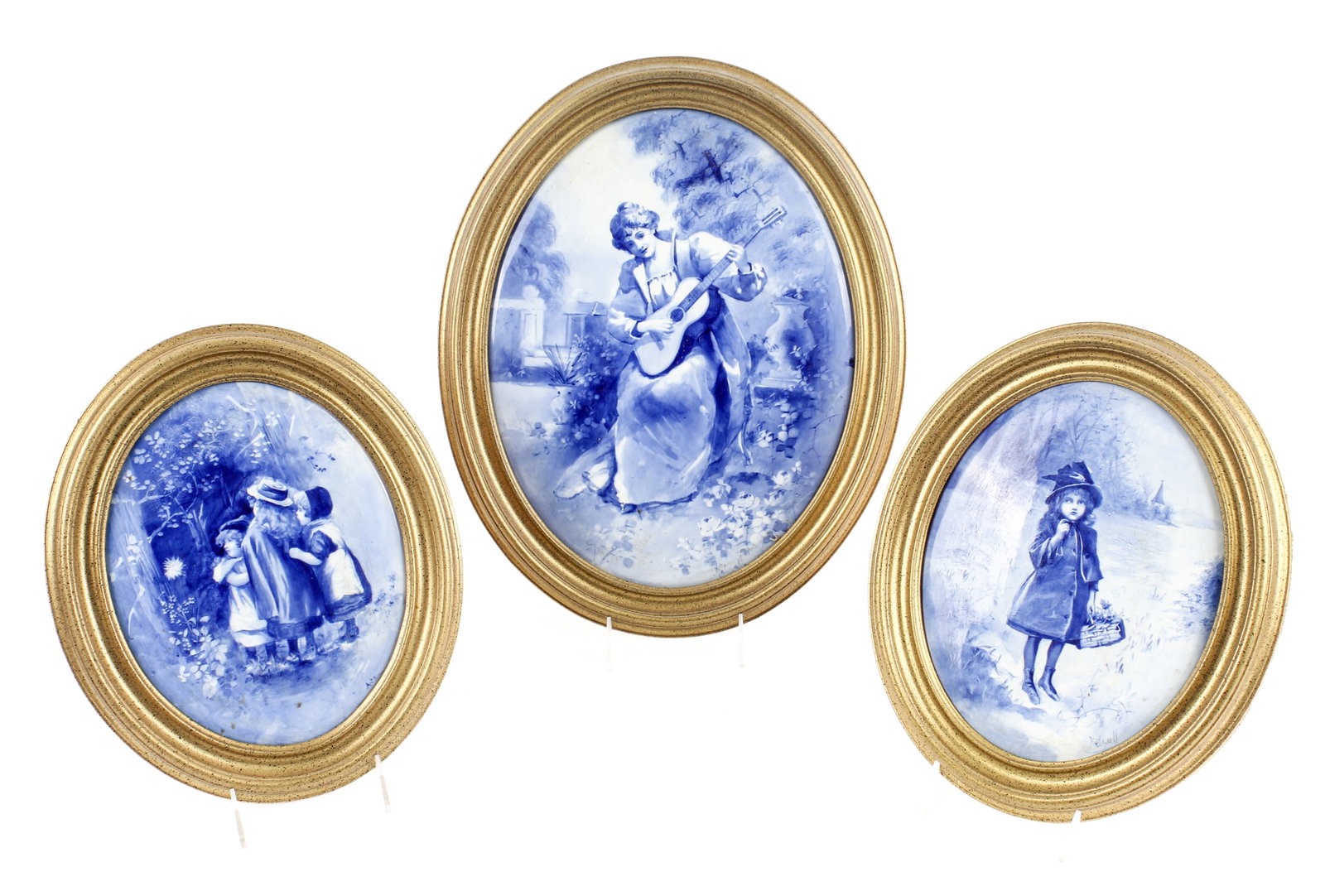 Three Royal Doulton Burslem Children's Ware Blue & White Plaques: Description: A group of three hand painted blue & white Royal Doulton Children's Ware porcelain plaques. Markings & Inscriptions: Each signed by the artist Date: Early 20th century Maker: Royal Doulto